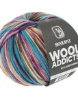 Multicolored skein of yarn with 'Wool Addicts' label on a white background