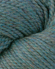 Close-up of a skein of middle tone teal with tan heathers yarn