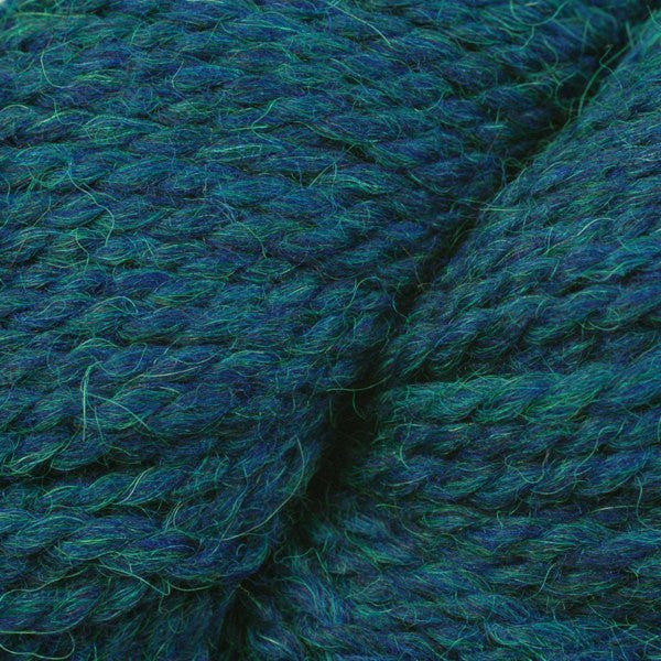 Close-up of a deep teal blue yarn with green heathers