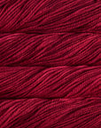 Close-up of red yarn with visible texture