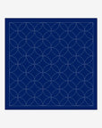Navy blue fabric with white geometric pattern on a light gray background