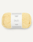 Ball of yellow yarn with a white label on a light gray background