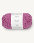 Ball of pink yarn with a label on a white background