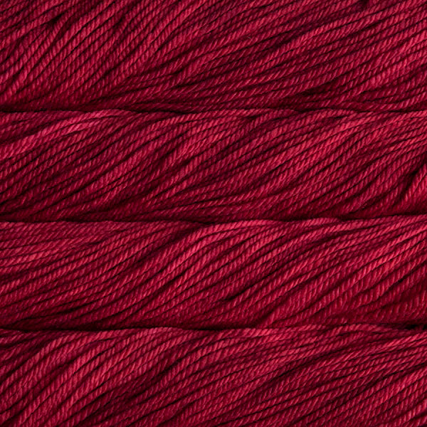Close-up of red yarn with visible texture