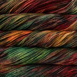 Close-up of multicolored yarn with a gradient of red, orange, yellow, green, and blue.