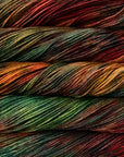 Close-up of multicolored yarn with a gradient of red, orange, yellow, green, and blue.