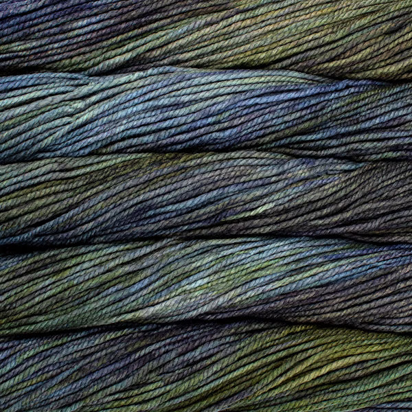Close-up of green and blue yarn skeins