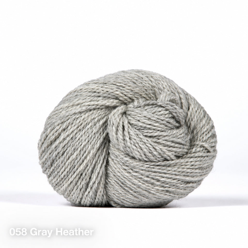 058 Gray Heather. a skein of medium-light gray heather DK weight yarn.